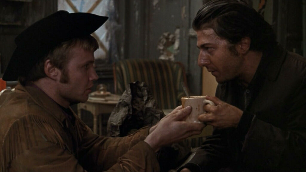 Passion of Arts: Jon Voigt und Dustin Hoffman halten eine Kaffeetasse zwischen sich in Asphalt-Cowboy