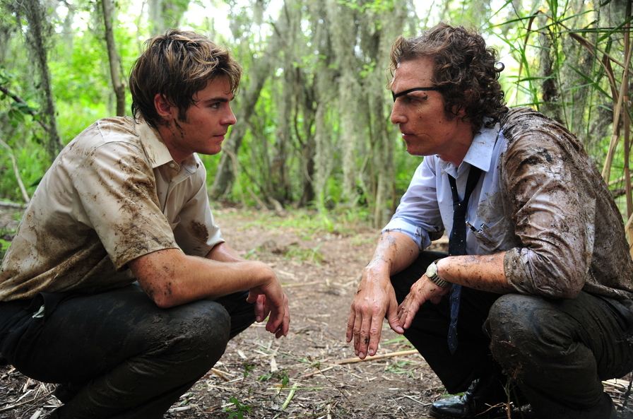 Passion of Arts: Jack und Ward knien im Sumpf und schauen sich an. Ward trägt eine Augenklappe