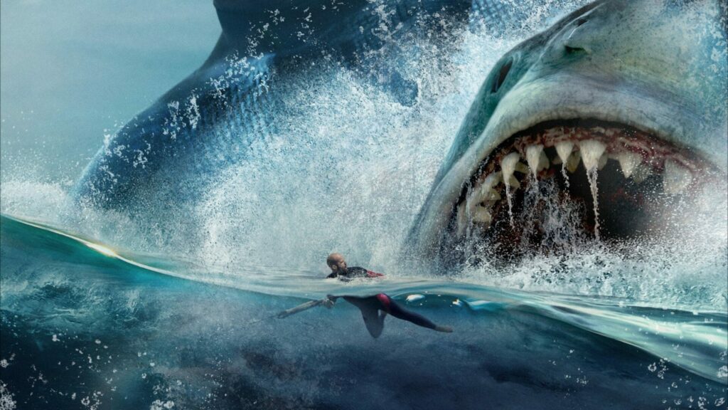 Passion of Arts Meg: Im Hintergrund ist ein großer Hai, der es auf den schwimmenden Mann im Vordergrund abgesehen hat