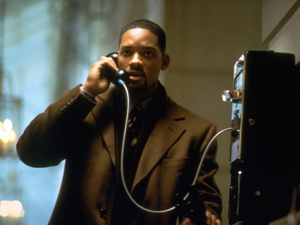 Robert Clayton Dean (Will Smith) telefoniert mit einem Münztelefon