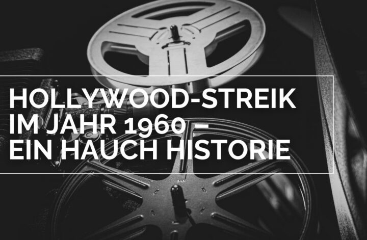 Titelbild zur Kolumne Hollywood-Streik im Jahr 1960 – Ein Hauch Historie. Darauf ist ein alter Filmprojektor aus der Froschperspektive zu sehen. Besonders ins Auge stechen die beiden großen Filmrollen. Das Bild ist klassisch schwarz weiß