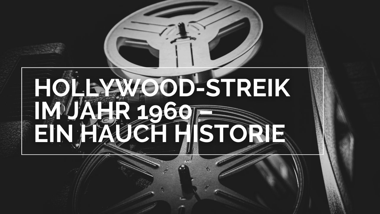 Titelbild zur Kolumne Hollywood-Streik im Jahr 1960 – Ein Hauch Historie. Darauf ist ein alter Filmprojektor aus der Froschperspektive zu sehen. Besonders ins Auge stechen die beiden großen Filmrollen. Das Bild ist klassisch schwarz weiß