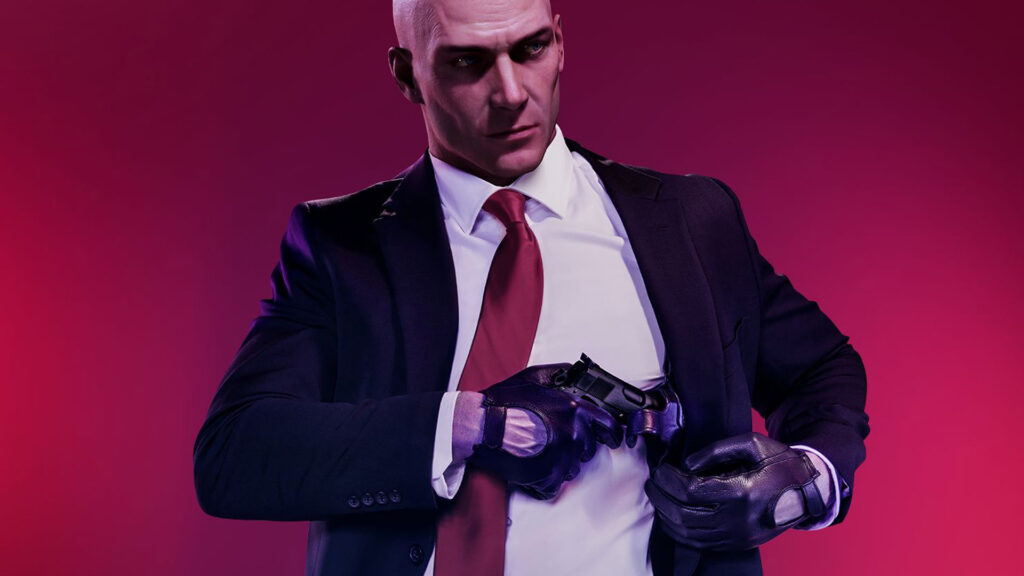Genre von Videospielen: Das Bild zeigt einen glatzköpfigen Mann, der einen Anzug trägt und eine rote Krawatte. Außerdem trägt er Lederhandschuhe und steckt gerade eine Waffe zurück in sein Brusthalfter