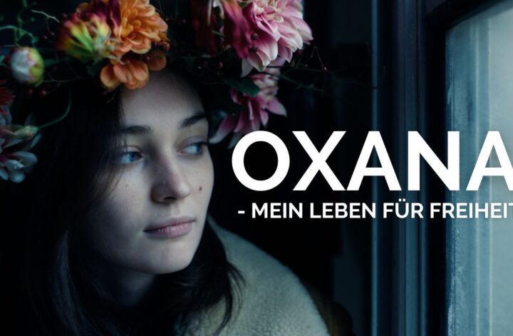 Oxana: Das Bild zeigt Oksana Schatschko mit Blumenkranz im Haar. Zusätzlich ziert das Bild den Schriftzug: Oxana - Mein Leben für Freiheit
