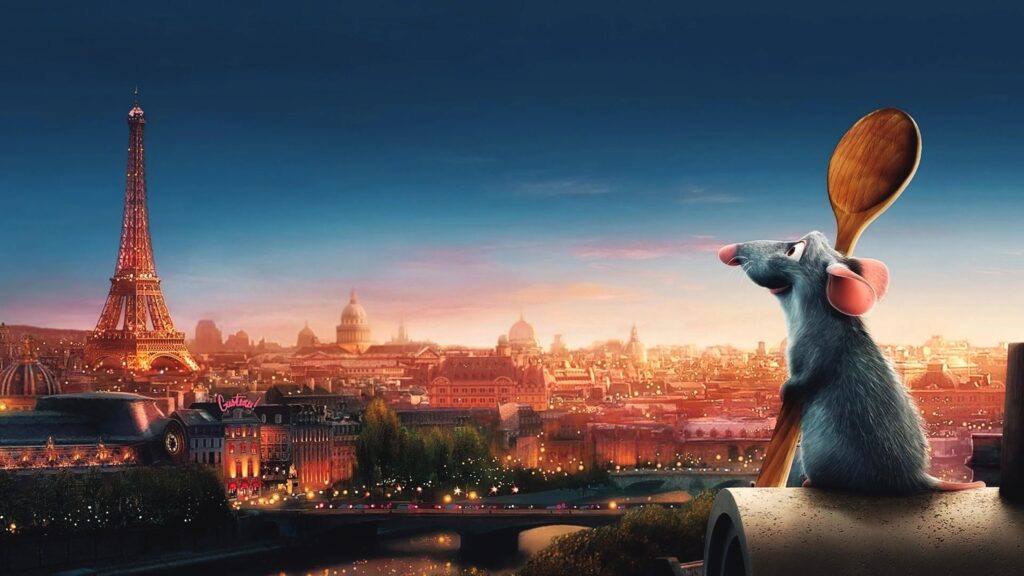 Remy aus dem Film Ratatouille hält einen Kochlöffel und schaut sehnsüchtig zum Eifelturm