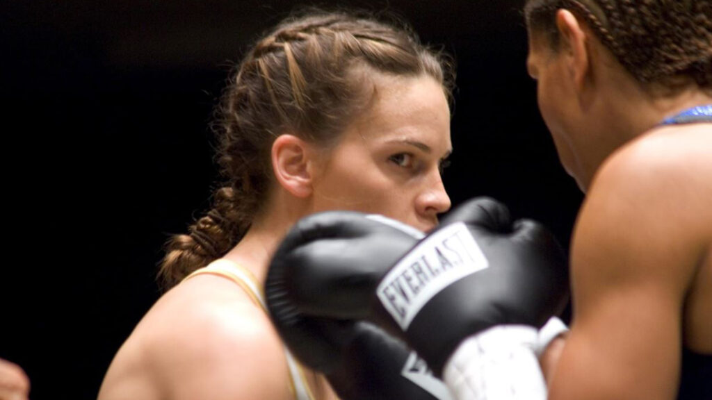 Das Bild zeigt Hilary Swank als Maggie Fitzgerald im Film "Million Dollar Baby" | Themenübersicht Januar 2026