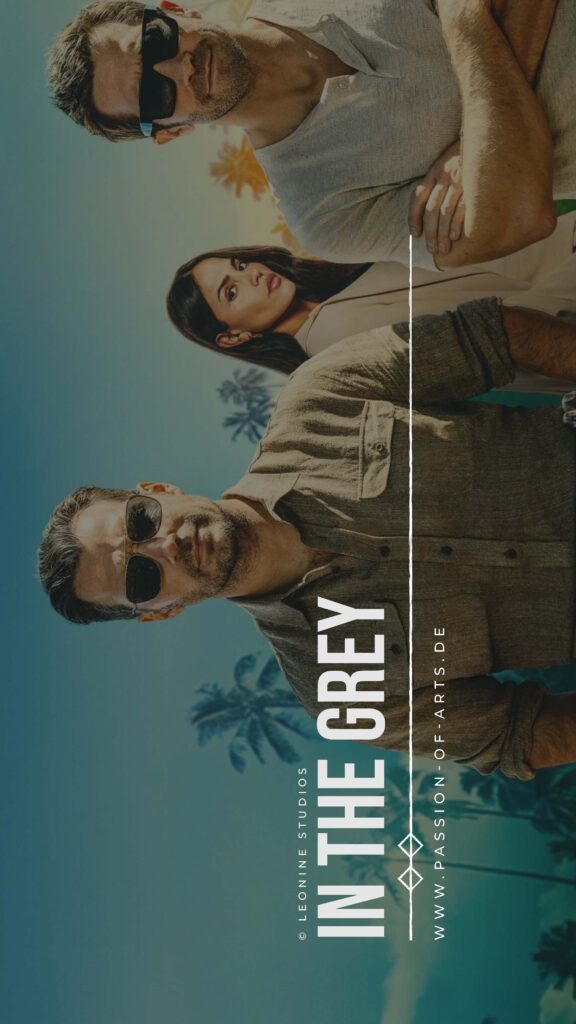 Henry Cavill, Eiza González und Jake Gyllenhaal stehen nebeneinander in sonniger Umgebung mit Palmen im Hintergrund. Alle drei tragen Sonnenbrillen und blicken ernst in die Kamera. Das Bild dient als Promo‑Motiv zum Film In the Grey.