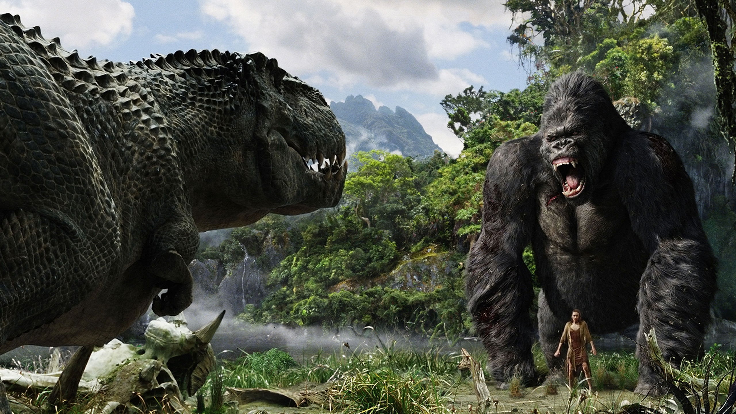 Auf dem Bild ist zu sehen, wie King Kong sich einem V-Rex im Kampf stellt um die vor ihm stehende Frau zu beschützen Die 5 besten Remakes