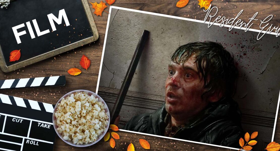 Gestaltete Grafik zur Filmkritik von Resident Evil, aus dem Jahr 2026, auf einem rustikalen Holzhintergrund mit verstreuten Herbstblättern. Links befinden sich eine Filmklappe, eine Tafel mit der Aufschrift „FILM“ und eine Schüssel Popcorn. Rechts ist ein eingearbeitetes Filmposter zu sehen, das Austin Abrams mit blutverschmierten Gesicht und aufgerissenen Augen zeigt. Er lehnt an einer Wand, die ebenso mit Blut bespritzt ist und Risse hat. Neben ihm sieht man das Rohr einer Schrotflinte aufragen. Oben rechts steht der Filmtitel Resident Evil in geschwungener Schrift. Die Grafik kombiniert Kinoelemente mit herbstlicher Dekoration.